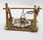 Fuego con travesaño y luz. Medidas: 14x10,5x7,5cm. Luz a 220V.
